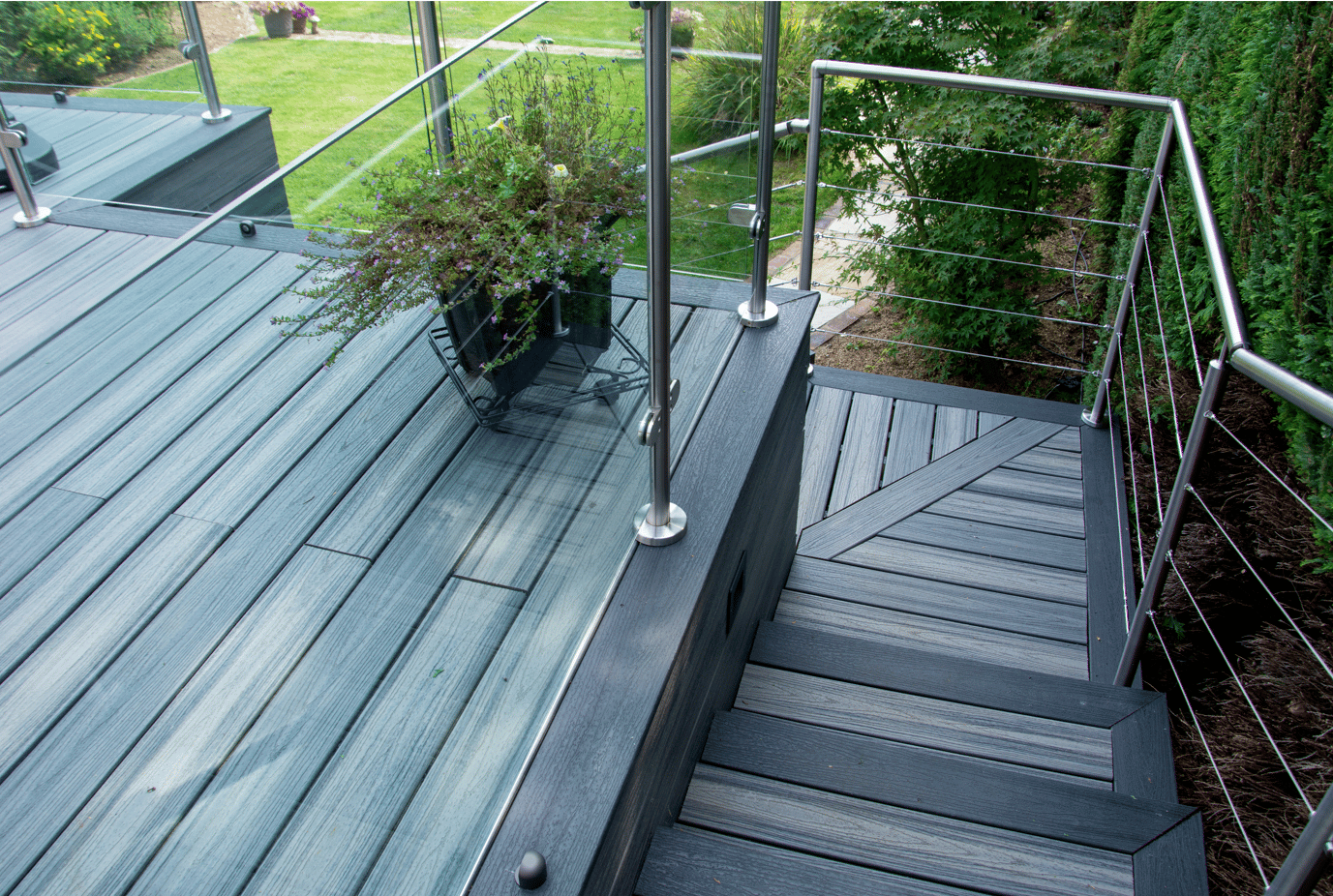 grey Trex decking design with cable balustrade in weybridge