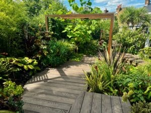 Tropical garden design with decking in Hertfordshire